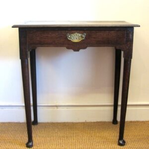 An unusual 18th Century English country oak side table of narrow proportions