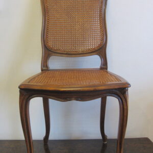 One of eight first half 20th Century French walnut dining chairs - CJF0500