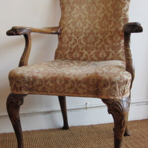 A decorative late 19th Century to early 20th Century English walnut armchair in George I & II style