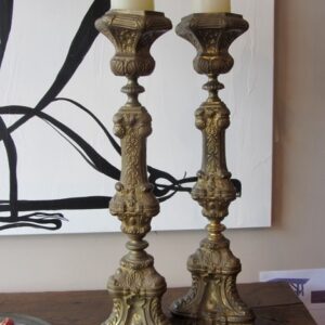 A pair of 19th Century French beaten brass torchieres with shell and leaf motifs
