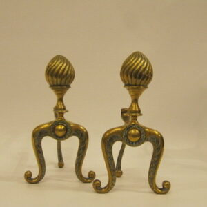 A decorative pair of early 20th Century English brass fire dogs in 18th Century style