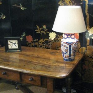 A decorative 19th Century Chinese export black lacquer eight fold screen