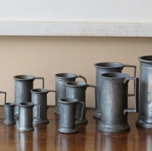 A graduated harlequin set of 14 late 19th Century French pewter measures - AA1871
