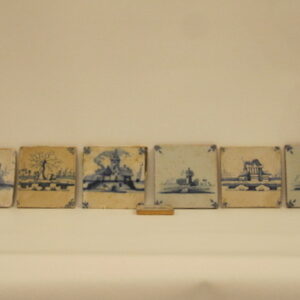 A collection of seven 18th Century Dutch 'Deft' hand painted tiles