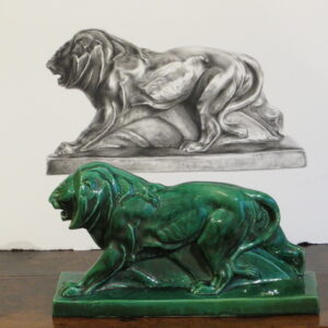 A rare French Deco green ceramic lion on stand