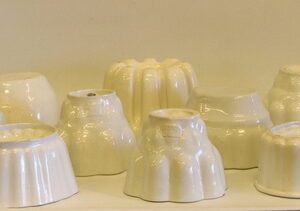 A collection of nine early 20th Century decorative white ceramic jelly moulds