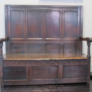 A fully panelled mid-late 17th Century English oak joined settle
