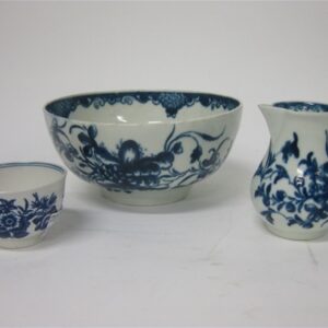 Three pieces of Worcester Dr Wall blue and white porcelain, a teacup, a sparrow beaked jug and one bowl.