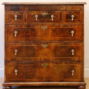 A decorative George I English walnut chest of drawers