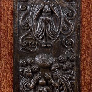 A well carved 16th Century Flemish oak panel of a rising angel with worshippers below.