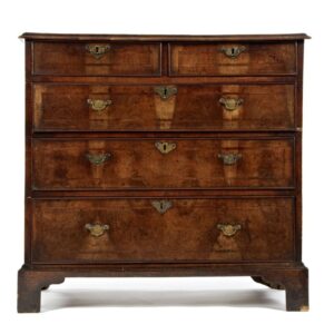 A George III walnut and feather banded chest of drawers - UK1827