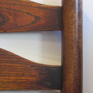 A harlequin set of eight first half 19th Century English country ash and alder ladder back chairs