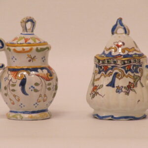Two early 20th Century attractive French lidded Faiene jugs, 1909