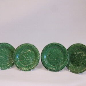 Four 19th Century French green majolica plates