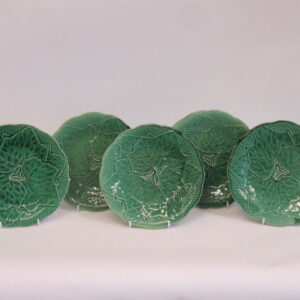 Set of five first half 19th Century French green majolica plates