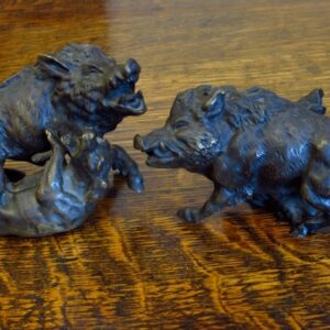 Two early 20th Century brass fighting boars