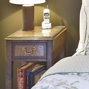 A pair of George III style figured oak bedside tables