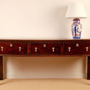 A good early 18th Century English oak low dresser