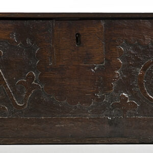A 17th Century English oak pannelled box