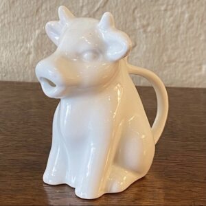 A very cute 20th century ceramic cow milk jug.