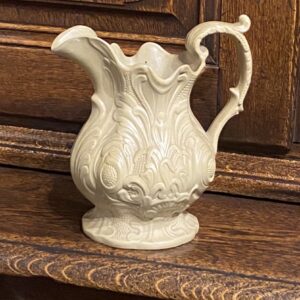 A decorative 19th century English acanthus leaf styled stoneware jug