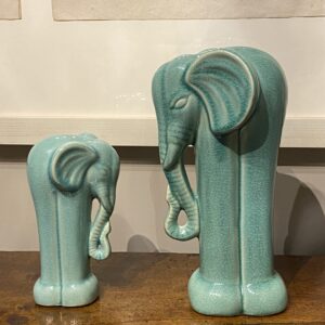 An Unusual pair of soft green 20th century tall vintage Elephants