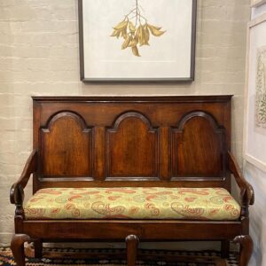19th century English oak three panelled settle, in early 18th century style.