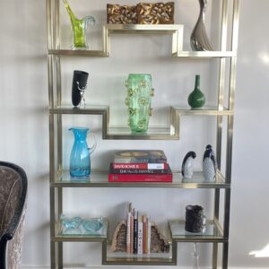 Pierre Vandel - Paris - Polished brass and bevelled glass display shelves.