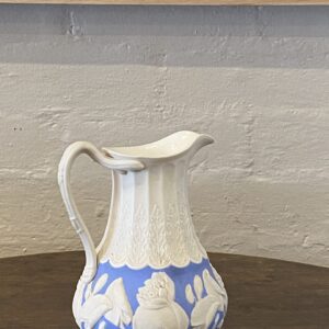 19th century English soft blue and off-white stoneware floral decorated jug