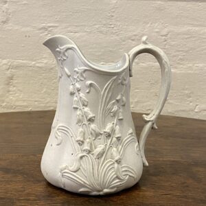 Mid 19th century English off white Lilly Bell decorated Parian Ware jug