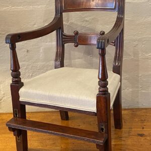 A rare first half 19th century English Regency mahogany childs chair, with adjustable foot rest.