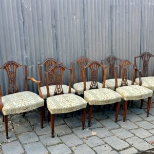 Complete set of eight English Hepplewhite revival dining chairs, including two armchairs.