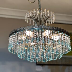 A mid-century Italian retro circular blue & clear glass chandelier with beaded fountains above