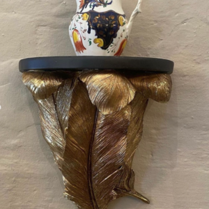 Decorative pair of contemporary gold feather shaped wall sconces.