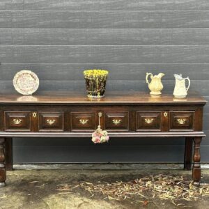 Late 17th century English open low dresser.