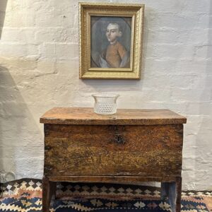 A rare 17th century English ash boarded chest of diminutive proportions.