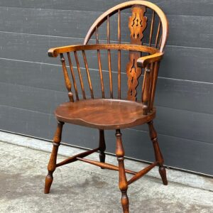 One of six  20th century American oak windsor arm chairs.