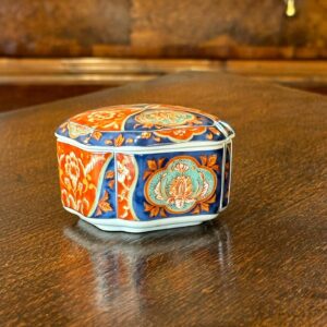 A miniature 19th century style Japanese Imari lidded spice bowl.