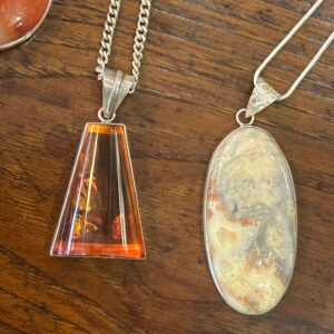 Several attractive gem stone necklaces, including Jade, Amber, Carnelian, Lace Agate.