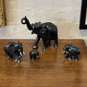 A family of four 19th century carved ebony elephants