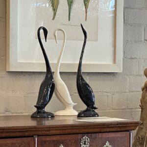 Elegant trio of vintage retro black glass birds.