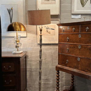 An unusual 20th century European turned and fret decorated standard lamp, with tilting retro reading shade.