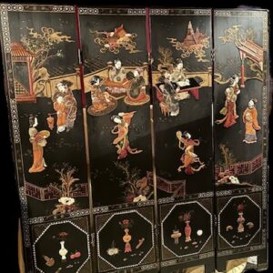 An exceptional late 19th Century Chinese export hand carved four panelled chinoiserie black laquered folding screen.